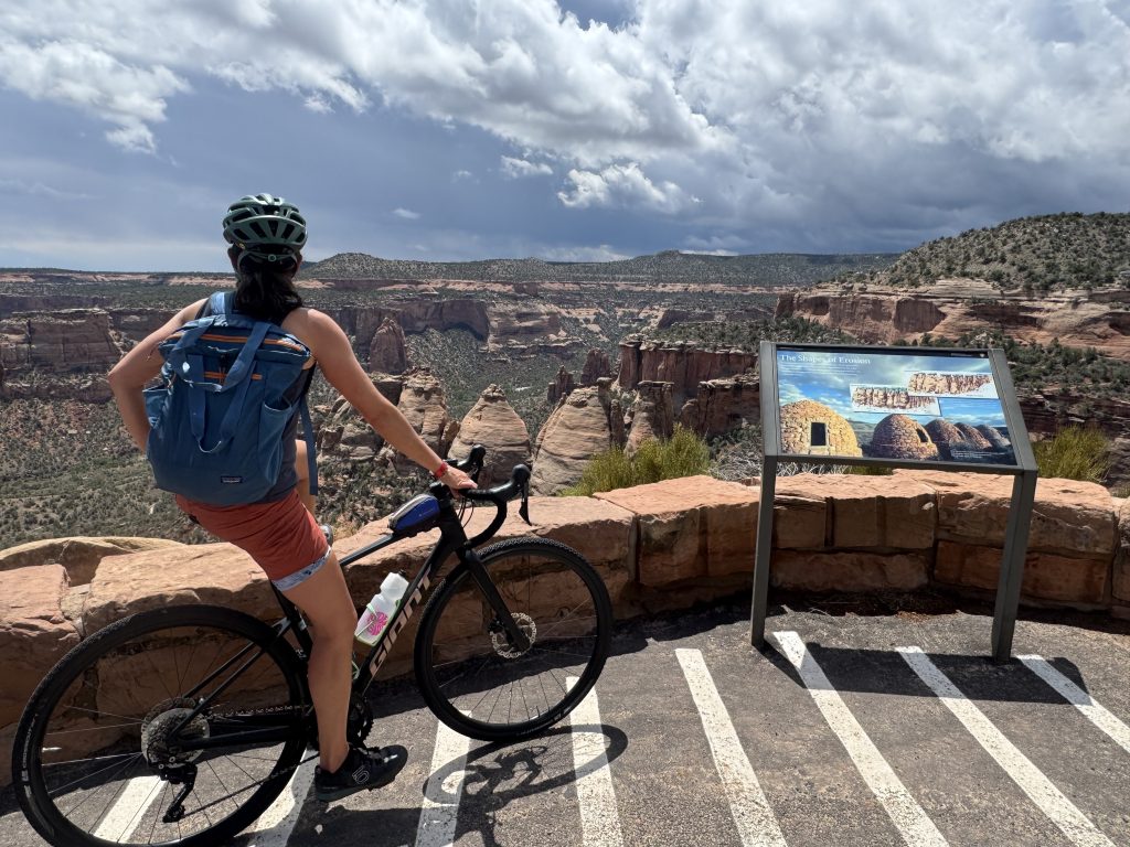 Cyclist overlooking the coke ovens while biking the colorado national monument
