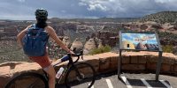 Cyclist overlooking the coke ovens while biking the colorado national monument