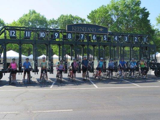 Kentucky Bike Tour Guests lining up at Keenland Starting Gate on Bike Tour with Wilderness Voyageurs