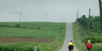 Bikers headed towards windmills